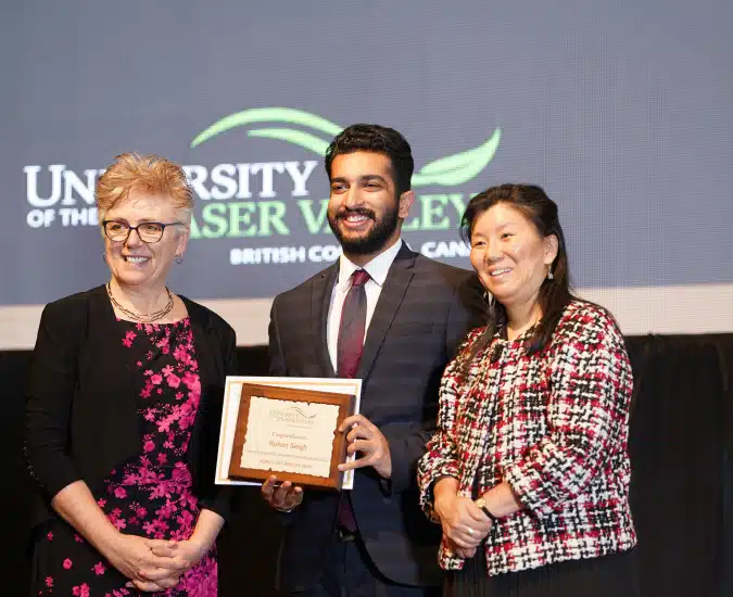 student getting Continued Academic Excellence Award
