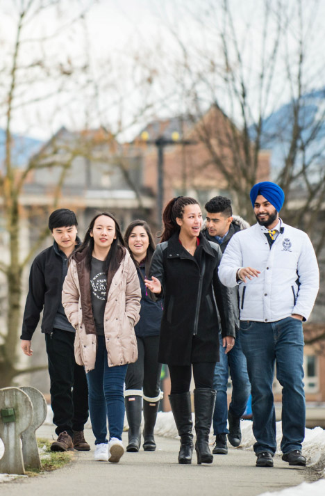 Confident guy walking with friends in canada